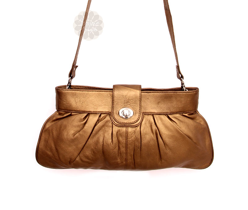 Vogue Crafts & Designs Pvt. Ltd. manufactures Popular Golden Sling Bag at wholesale price.